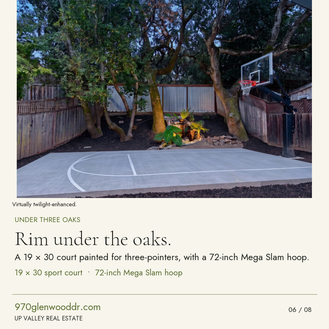 Rim under the oaks. The 19 by 30 sport court beneath three oaks, with a 72-inch Mega Slam hoop.